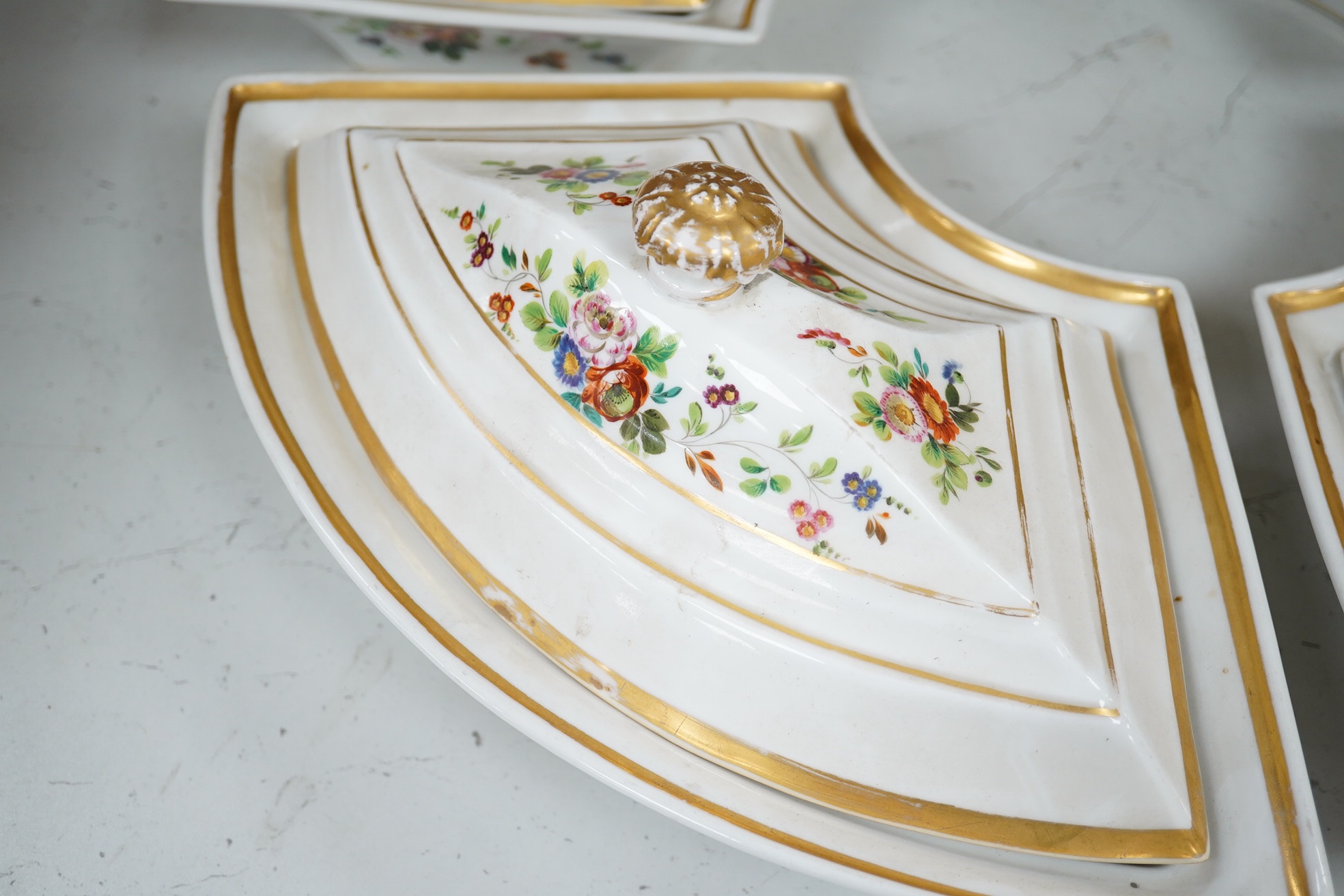 A Pan's porcelain set of four supper dishes and covers, early 19th century, each 37cm wide. Condition - fair, one cover broken, one knop repaired